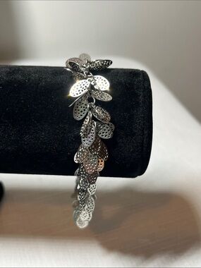 TOCARA Silver Leaf Cascade Bracelet 
STAINLESS STEEL
Stamped